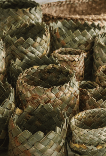 a collection of kete, woven baskets